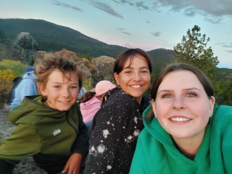 2 campers and counselor Addy at Galilee Point