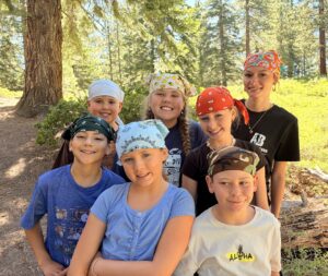 Counselor Hadly and campers at rock climbing